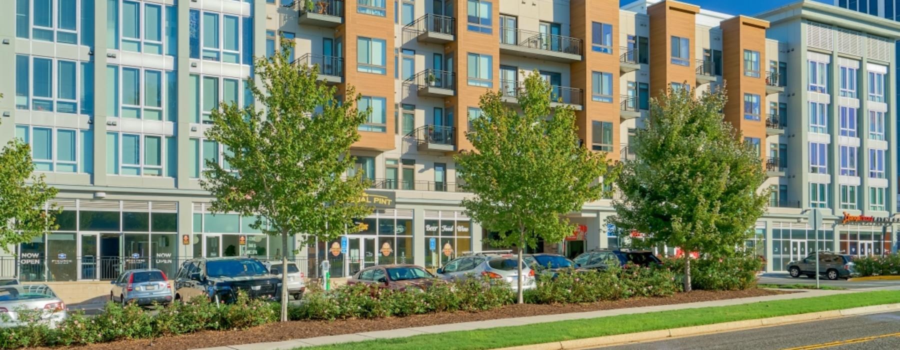 a building with cars parked in front