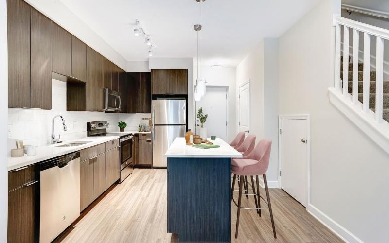 a kitchen with a table and chairs